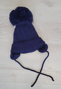 Cable knit pompom tie under hat