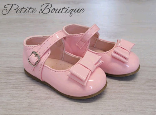 Pink bow patent shoes