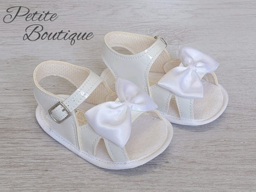 White patent soft sole bow sandals