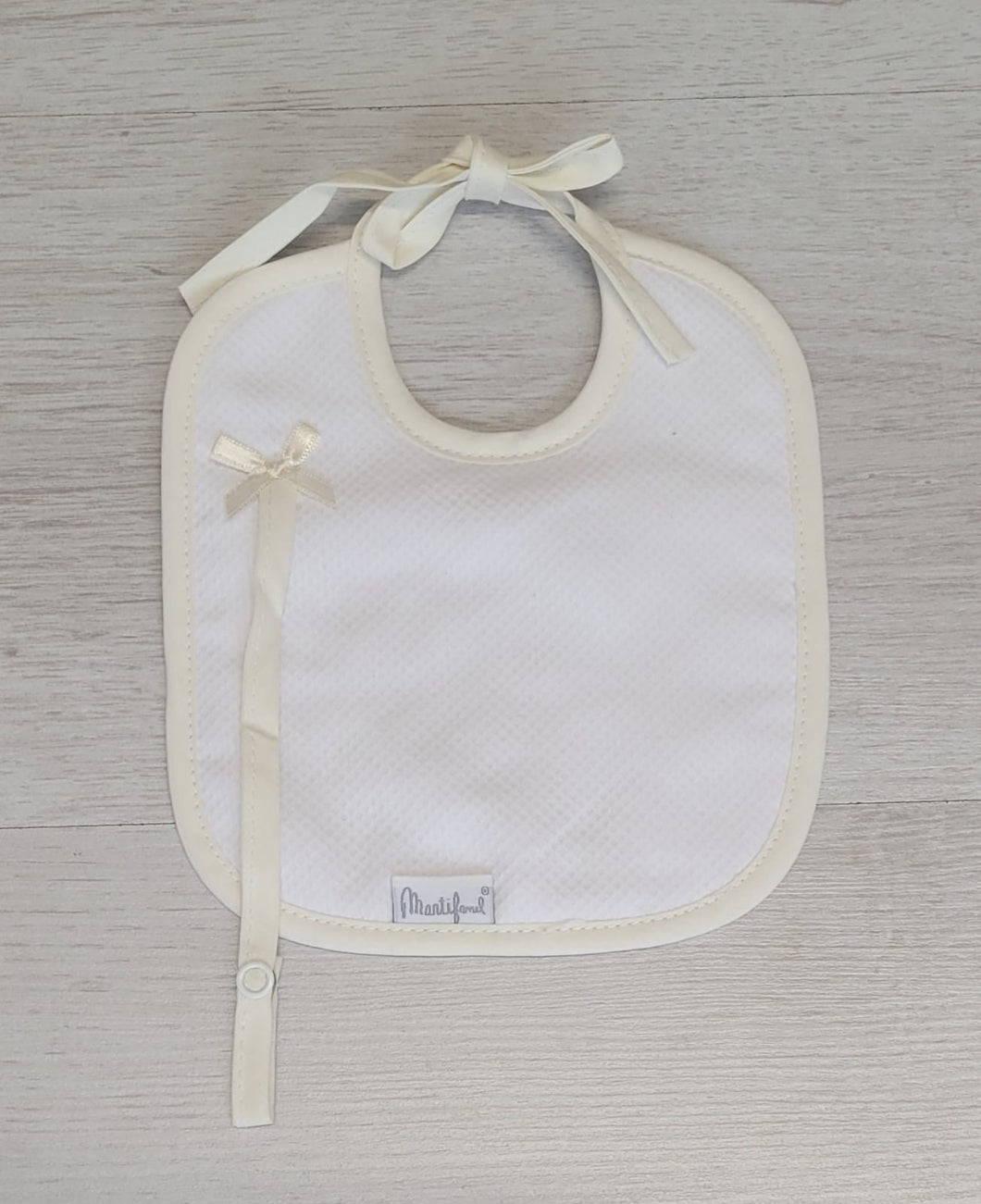Spanish white/cream bib with dummy clip
