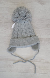 Cable knit pompom tie under hat