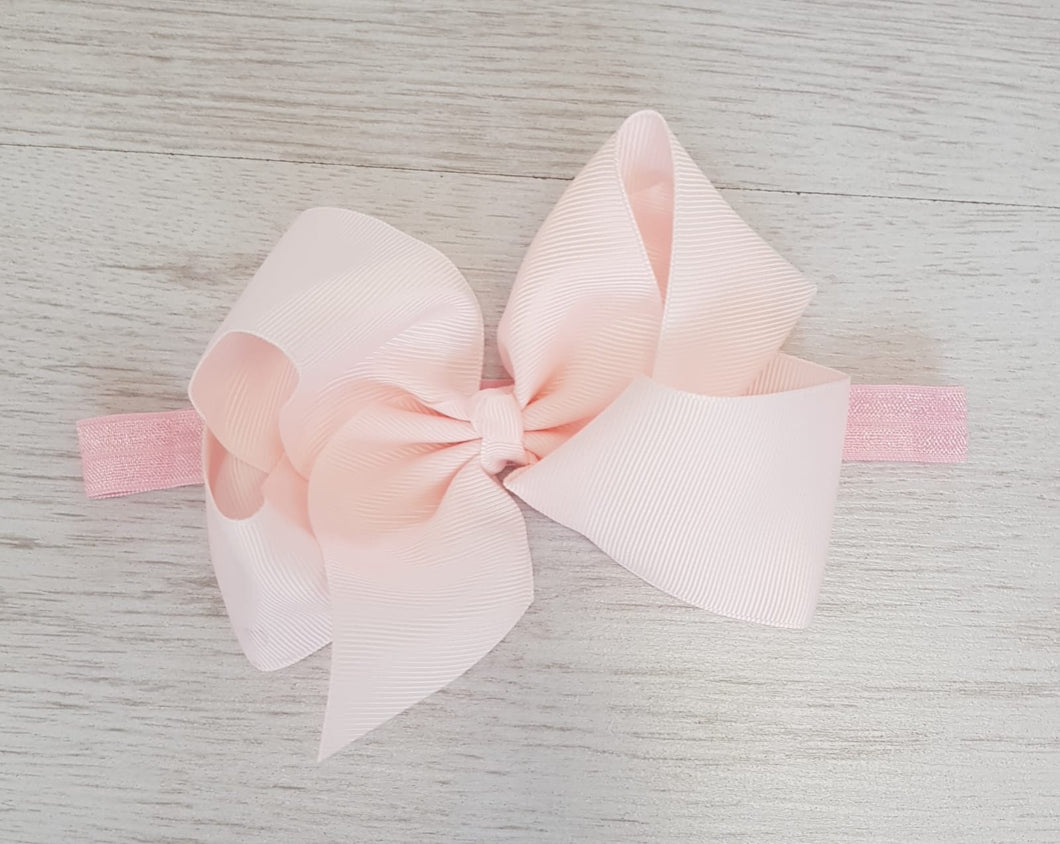 Pale pink hair bow