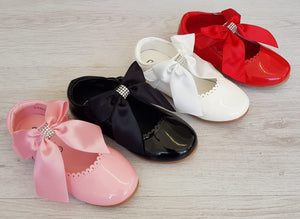 Pink patent ribbon shoes