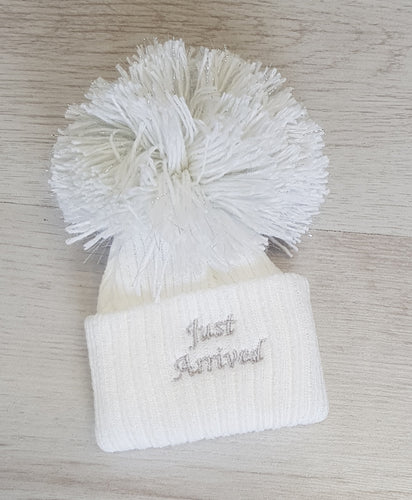 White ‘just arrived’ pompom hat