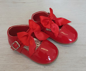 Red patent bow shoes