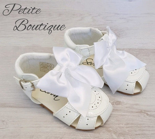 White patent bow sandals