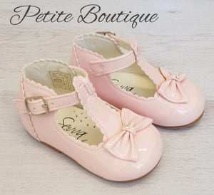 Pink patent t-bar bow shoes