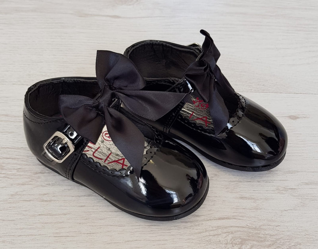 Black patent bow shoes