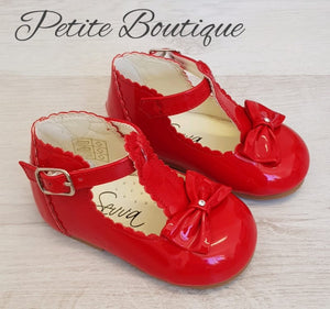 Red patent t-bar bow shoes