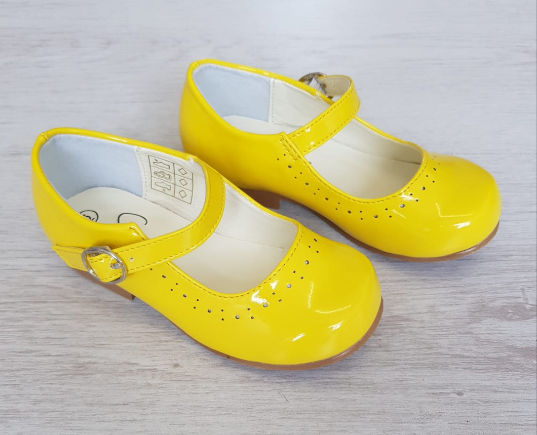 Yellow patent shoes