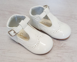 White patent T-bar shoes