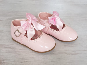Pink patent bow shoes