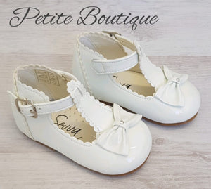 White patent t-bar bow shoes