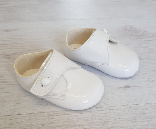 White patent button over soft sole shoes
